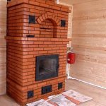 Brick stove with finished glazed firebox
